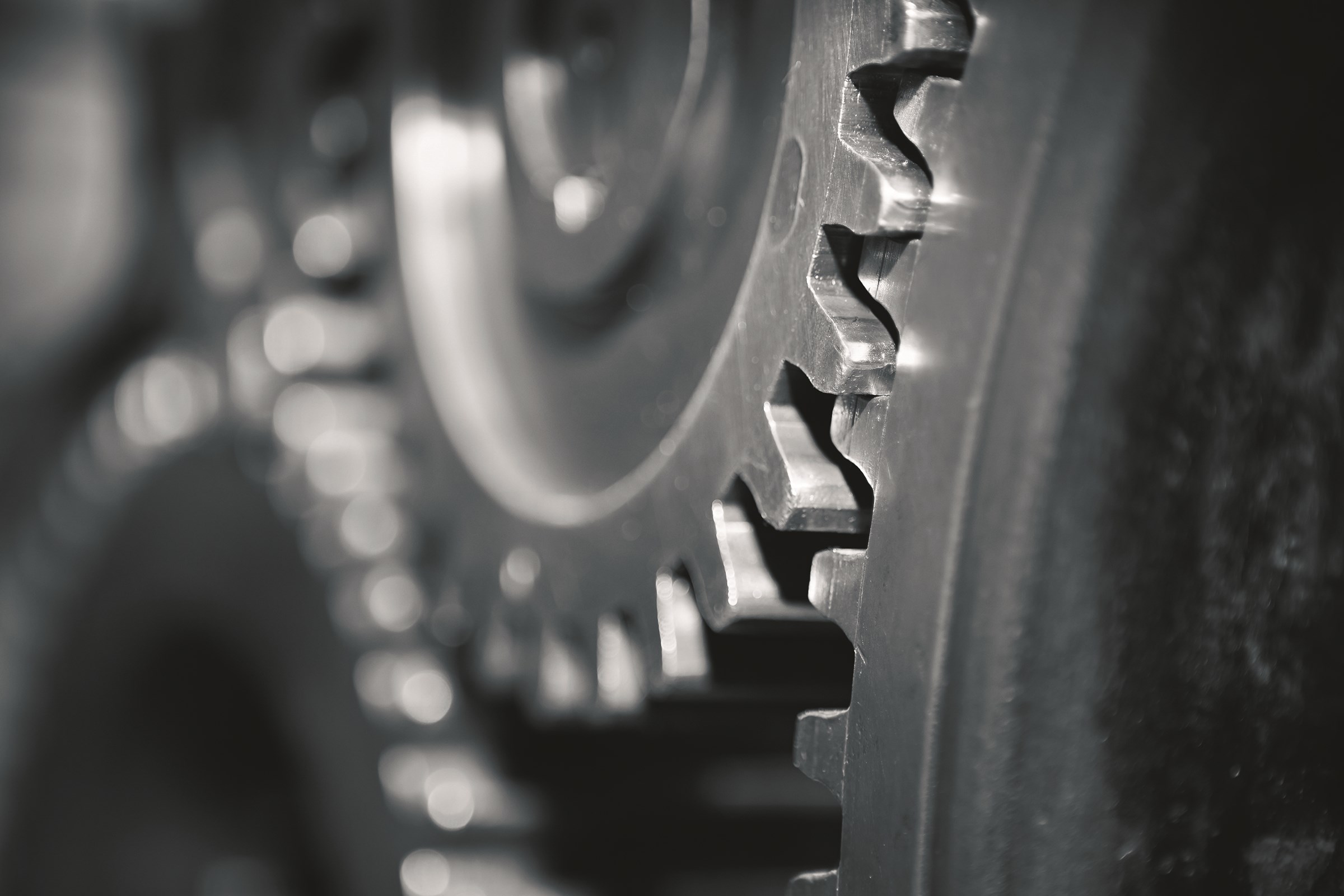 Close-up of gears in dark steel gray