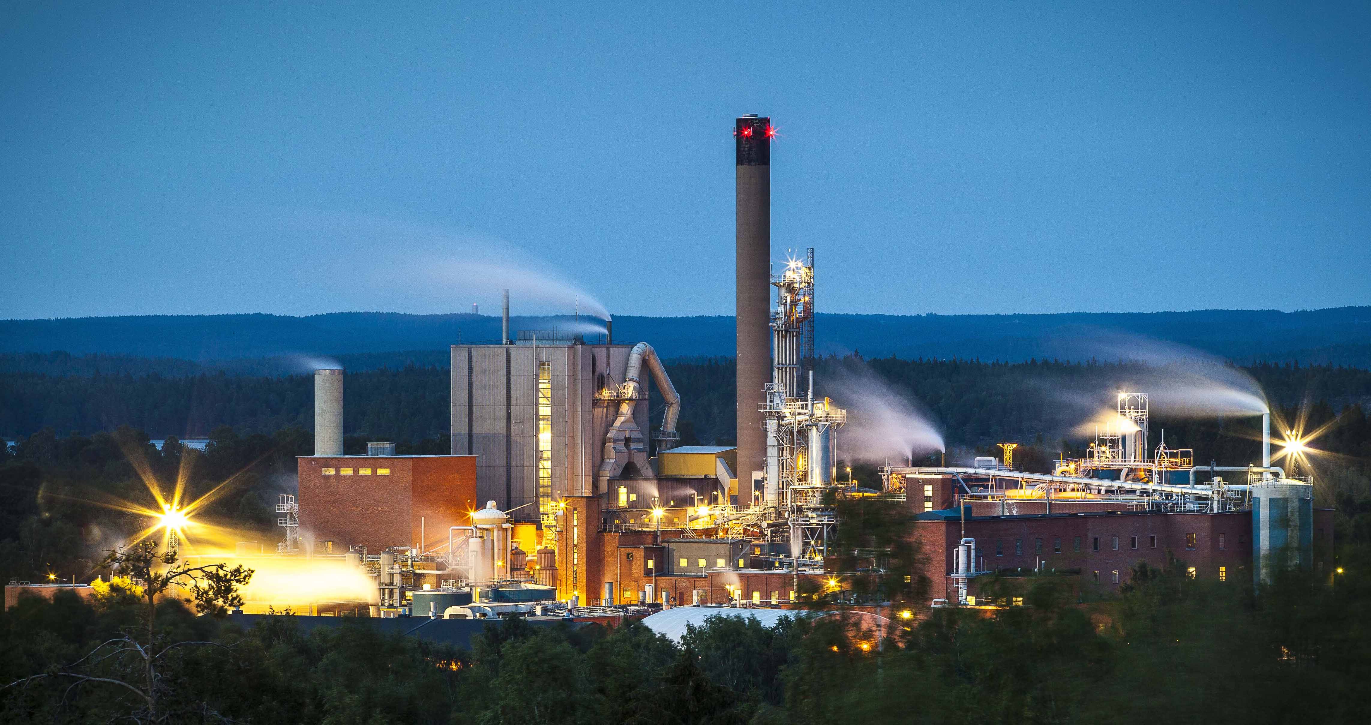 View of pulp mill at dusk 