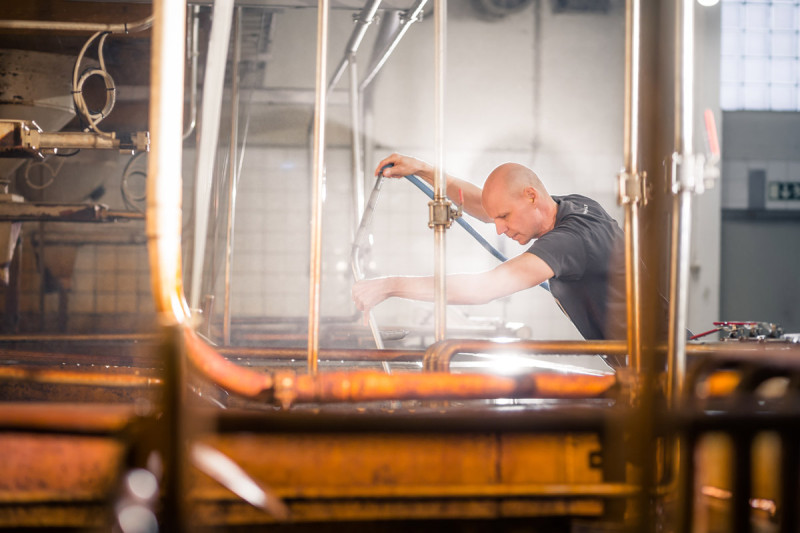 Man working in the process of malting barley.