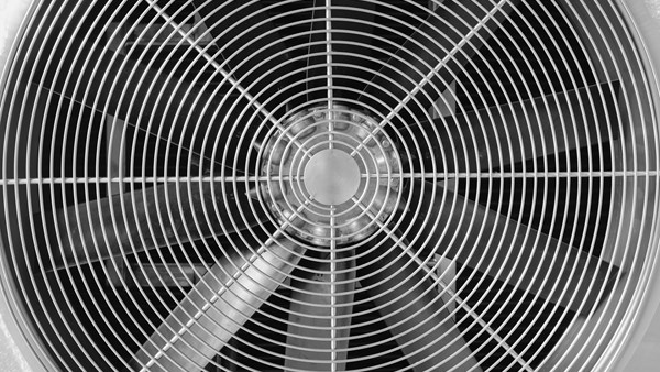 Close-up of a stainless steel industrial ventilation fan